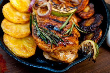 Image showing roasted grilled BBQ chicken breast with herbs and spices 