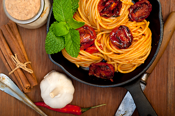 Image showing italian spaghetti pasta and tomato with mint leaves 