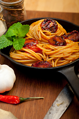 Image showing italian spaghetti pasta and tomato with mint leaves 