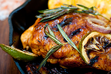 Image showing roasted grilled BBQ chicken breast with herbs and spices 