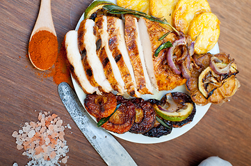 Image showing roasted grilled BBQ chicken breast with herbs and spices 