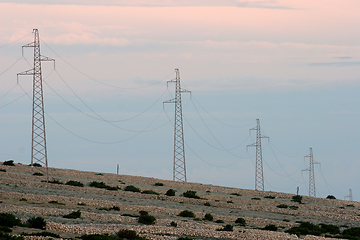 Image showing Power lines and array of electric pylons