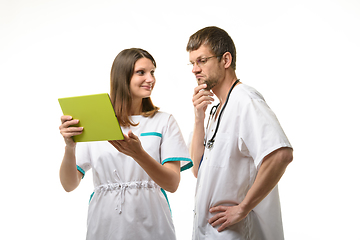 Image showing Doctor grimaces at patient test results