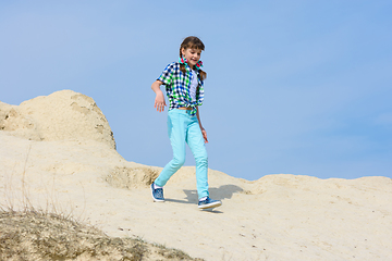 Image showing Girl runs down the hill