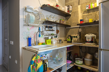 Image showing Interior of a temporary habitable kitchen in an unrepaired room