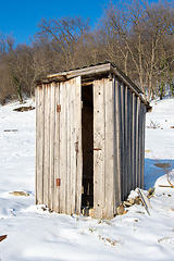 Image showing Old wooden outdoor toilet in winter weather