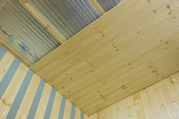 Image showing Construction of a country house, clapboard decoration of walls and ceilings in the room