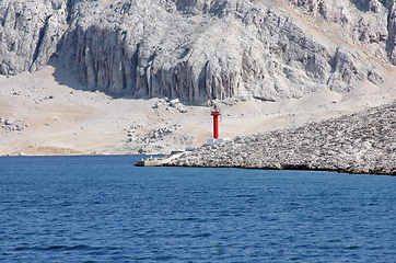 Image showing Red see light on island with mountain background.