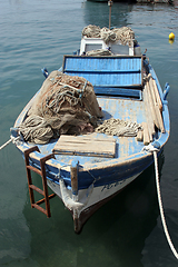 Image showing A wooden rowing boat tide down