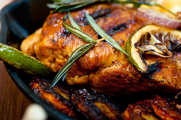 Image showing roasted grilled BBQ chicken breast with herbs and spices 