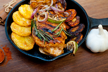 Image showing roasted grilled BBQ chicken breast with herbs and spices 