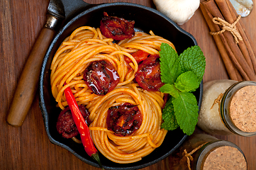 Image showing italian spaghetti pasta and tomato with mint leaves 