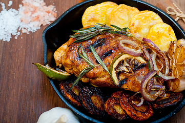 Image showing roasted grilled BBQ chicken breast with herbs and spices 