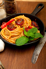 Image showing italian spaghetti pasta and tomato with mint leaves 