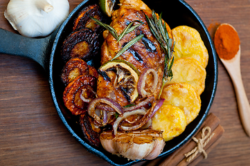 Image showing roasted grilled BBQ chicken breast with herbs and spices 