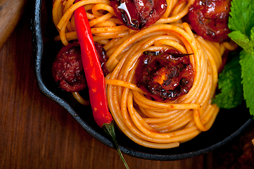 Image showing italian spaghetti pasta and tomato with mint leaves 