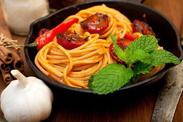 Image showing italian spaghetti pasta and tomato with mint leaves 