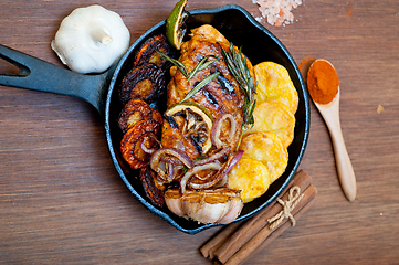 Image showing roasted grilled BBQ chicken breast with herbs and spices 