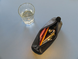 Image showing Glass and pencil case