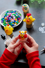 Image showing Child\'s hands hold a painted egg as a gift to celebrate easter