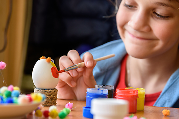 Image showing Happy girl painting easter eggs for the holiday