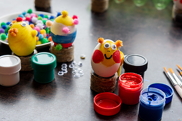 Image showing Easter egg crafts, paints and decorative elements are on the table