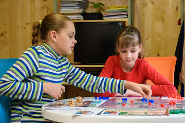 Image showing Two girls playing a board game