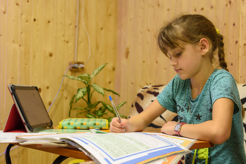 Image showing Girl doing homework in the interior of a country house room