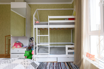 Image showing Bedroom interior with large children\'s bunk bed