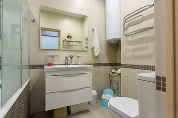 Image showing Interior of a modern bathroom combined with a toilet