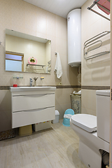 Image showing The interior of a compact toilet room in an apartment