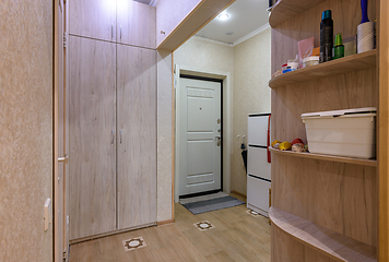 Image showing Interior of a classic hallway room with a large wardrobe in a studio apartment