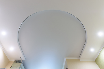 Image showing Horseshoe-shaped two-level suspended ceiling, the lower level is made of plasterboard, the upper level is stretched from PVC