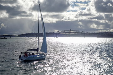 Image showing Auckland bridge view from the sea and sailing ship, New Zealand