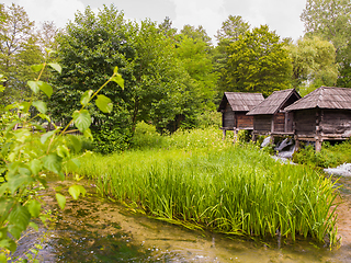 Image showing Old wooden waterills