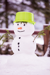 Image showing smiling snowman with green hat