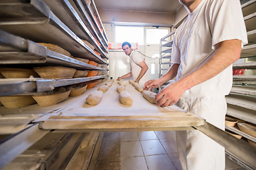 Image showing bakers preparing the dough