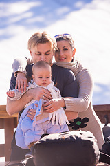 Image showing young happy family with little child enjoying winter day