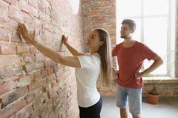 Image showing Young couple doing apartment repair together themselves