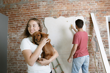 Image showing Young couple doing apartment repair together themselves