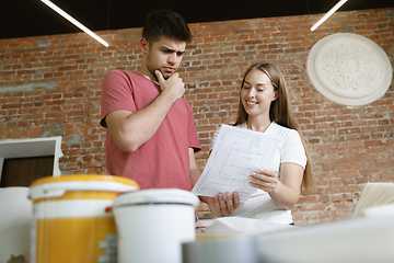 Image showing Young couple doing apartment repair together themselves