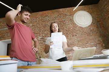 Image showing Young couple doing apartment repair together themselves