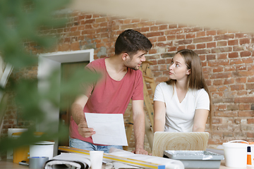 Image showing Young couple doing apartment repair together themselves