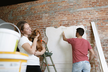 Image showing Young couple doing apartment repair together themselves