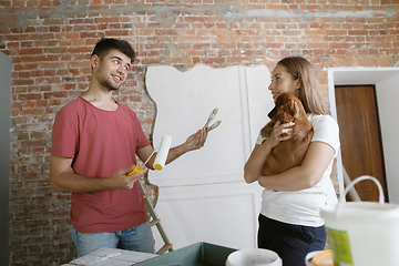 Image showing Young couple doing apartment repair together themselves