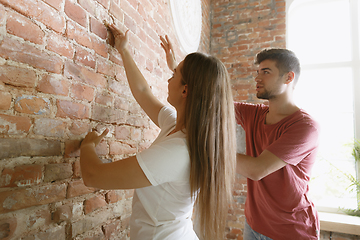 Image showing Young couple doing apartment repair together themselves