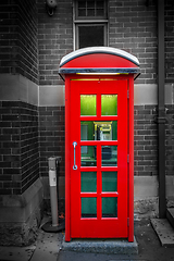 Image showing Vintage UK red phone booth