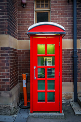 Image showing Vintage UK red phone booth