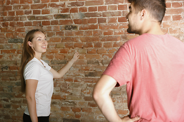 Image showing Young couple doing apartment repair together themselves