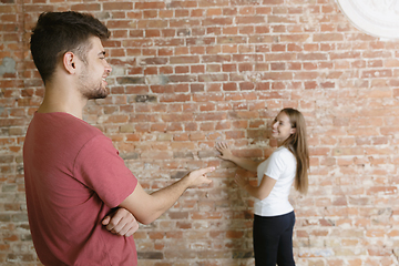 Image showing Young couple doing apartment repair together themselves